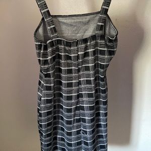 I’m selling a black and white plaid dress with a small slit on the left leg